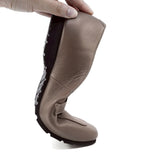Taupe flat shoes with a black sole