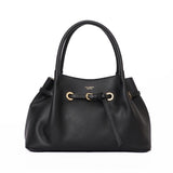 Black handbag with gold accents on a white background