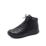 A single black mid-calf lace-up boot with a textured leather-like finish, black laces, and a thick black sole, photographed on a plain white background.