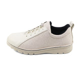 White sneaker with black lining on a white background