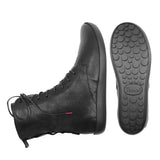A pair of black high-top lace-up boots shown on a white background, with one boot displaying the side profile and the other showing the textured outsole. The brand name 'Think!' is embossed on the sole.