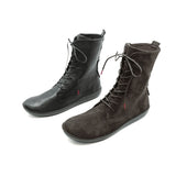 A pair of mid-calf lace-up boots, one in black leather and the other in dark brown suede, displayed on a clean white background.