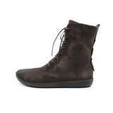 A single black suede ankle boot with a pointed toe and a low block heel, shown from a side profile on a clean white background.