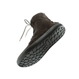 A dark brown suede ankle boot with a thick black textured sole, shown floating against a solid white background.
